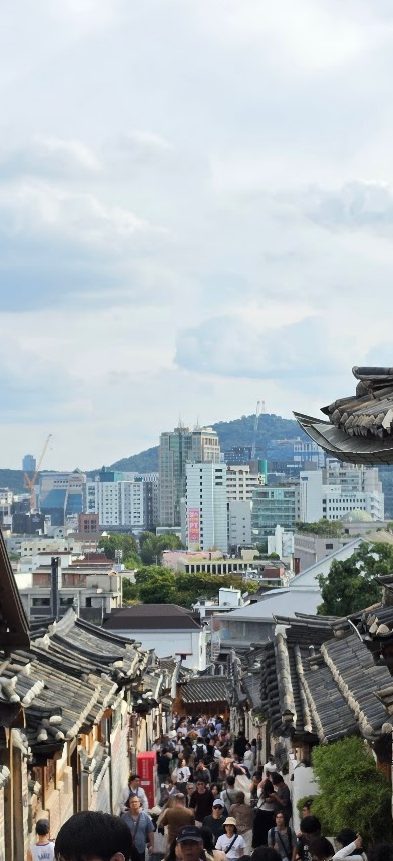 A narrow Bukchon street packed with visitors